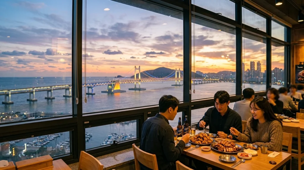 Iconic Gwangandaegyo Bridge view at sunset through restaurant window with diners
